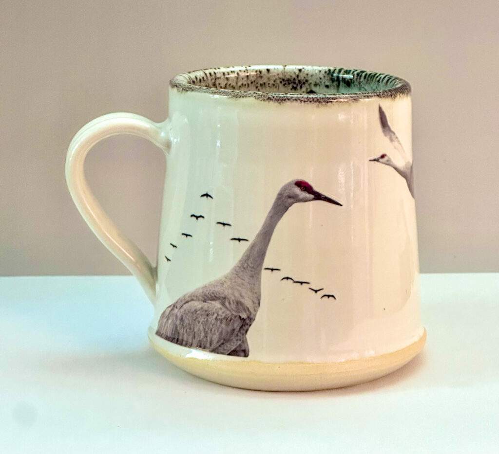 Large mug with images of Sandhill Cranes.